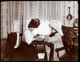 Mrs. Leslie Carter Seated with a Woman Reading a Crystal Ball, 1904